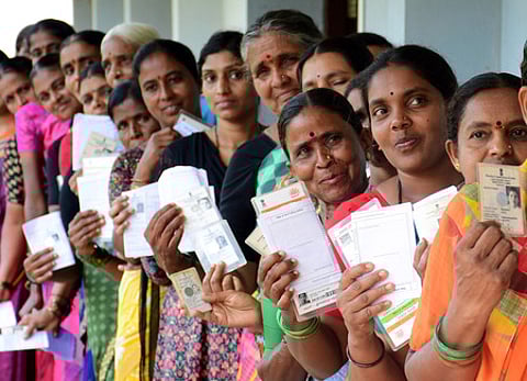 10/05/2023 ? MYSURU: Women voters queue up at a polling booth to caste their vote for assembly election in Mysuru - Express Photo by Udayshankar S.