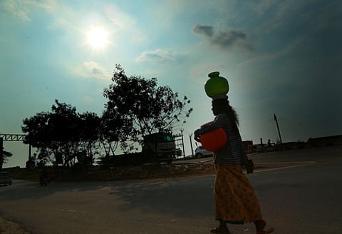 22-04-2024:KOCHI: A nomadic woman carries drinking water from a far away place in the summer season on Monday.| Express Photo by TP Sooraj ( Stand