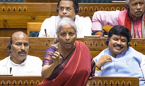 மக்களவையில் பேசிய மத்திய நிதி அமைச்சா் நிா்மலா சீதாராமன். ~மக்களவையில் பேசிய காங்கிரஸ் எம்.பி. கௌரவ் கோகோய்.