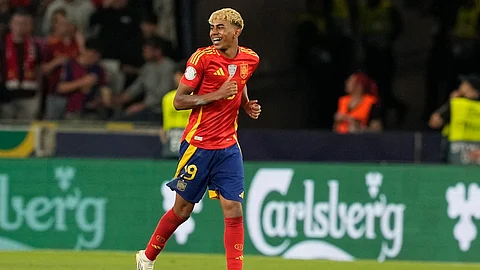Spain's Lamine Yamal celebrates after scoring his side's third goal against France during the Nations League semifinal soccer match between Spain and France at the MHPArena.