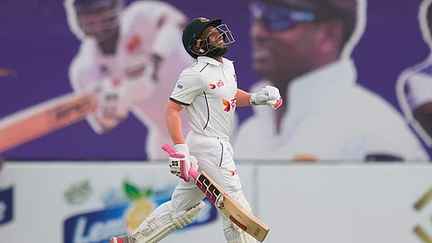 Bangladesh's Mushfiqur Rahim celebrates his century during the first day of the first cricket test match between Sri Lanka and Bangladesh in Galle