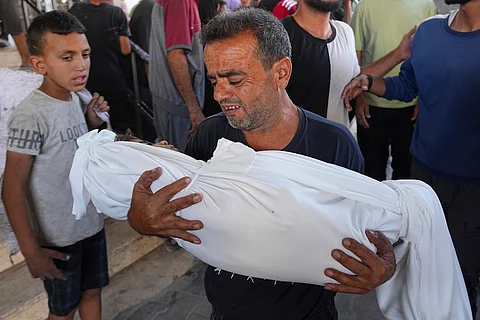 Israeli forces and drones fire on hundreds of Palestinians waiting for aid