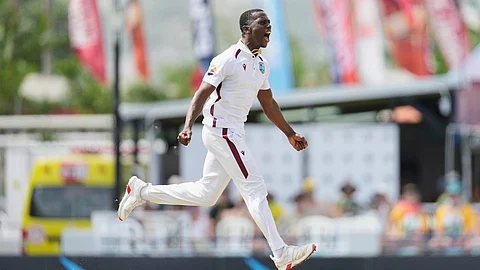 West Indies' Shamar Joseph celebrates taking the wicket of Australia's Beau Webster during day one of the first cricket Test match at Kensington Stadium in Bridgetown