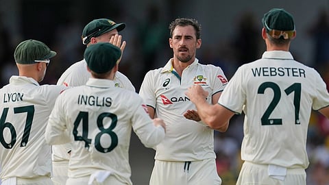 Australia's Mitchell Starc celebrates taking the wicket of West Indies' John Campbell during day one of the first cricket Test match at Kensington Stadium in Bridgetown, Barbados,