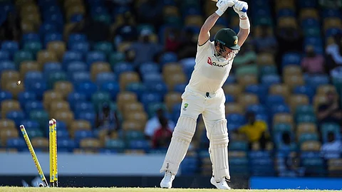 Australia's Josh Inglis is bowled by West Indies' Jayden Seales on day two of the first cricket Test match at Kensington Stadium in Bridgetown,