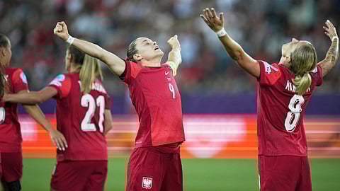 Poland's Ewa Pajor, centre, celebrates with Poland's Ewelina Kamczyk after scoring her side's second goal during the Women's Euro 2025,