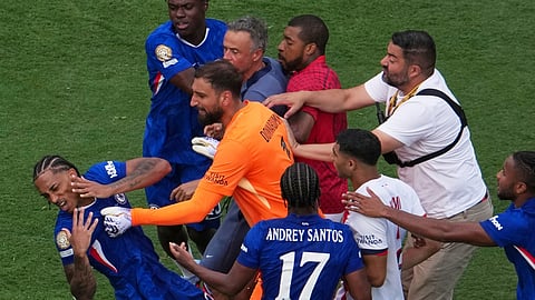 Chelsea's Joao Pedro (20) goes down after a scuffle after the Club World Cup final soccer match between Chelsea and PSG in East Rutherford