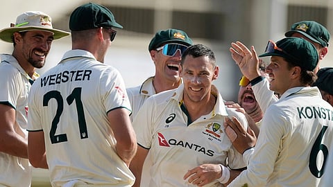 Australia's Scott Boland celebrates after taking the wicket of West Indies' Jomel Warrican to complete a hat trick on day three