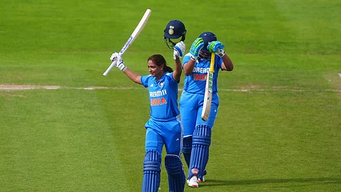 Harmanpreet Kaur celebrates after scoring a century.