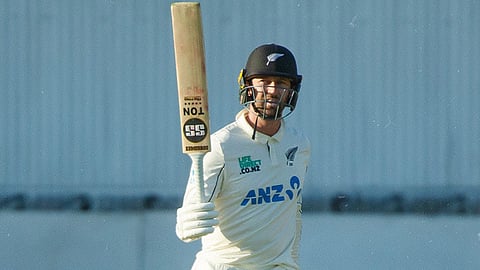 Devon Conway celebrates after scoring a half-century