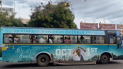 Idli kadai poster on a government bus.