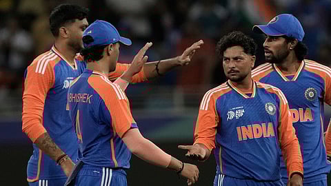 India's Kuldeep Yadav, second right, celebrate the wicket of United Arab Emirates's Rahul Chopra during the Asia Cup
