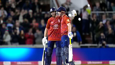 England's Phil Salt, left, and Harry Brook celebrate after finishing the first innings on 304 runs against South Africa during