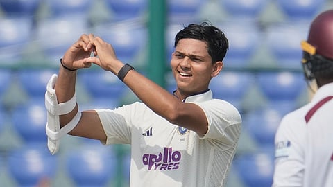 India's Yashasvi Jaiswal celebrates after scoring a century on the first day of the second cricket test match between India,West Indies