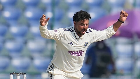 India's Kuldeep Yadav celebrates the dismissal of West Indies' Shai Hope on the third day of the second cricket test match India West Indies.