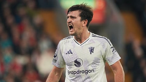 Manchester United's Harry Maguire celebrates after scoring his side's second goal during the English Premier League soccer match.