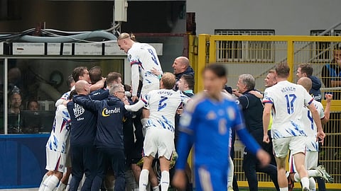 Norway's Erling Haaland, top, celebrates with teammates after Jorgen Strand Larsen scored his side's fourth goal during the 2026 World Cup qualifiers.