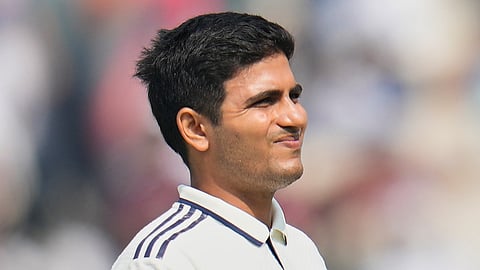 India's captain Shubman Gill reacts as he leaves the field after retired hurt on the second day of the first cricket test match in Kolkata, India.