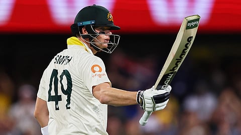 Australia's captain Steve Smith celebrates his fifty runs during the second Ashes cricket test match between Australia and England in Brisbane