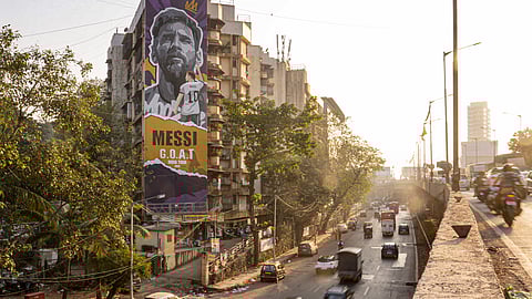 A mural of Argentine football legend and 2022 FIFA World Cup-winning captain Lionel Messi adorns a building ahead of his visit, in Mumbai,