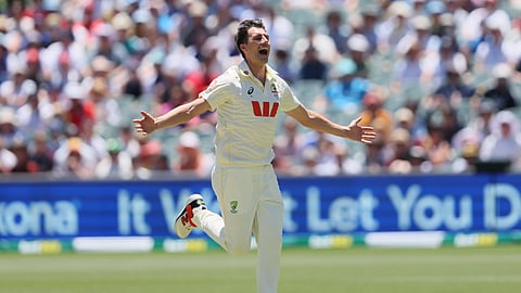 Australia's captain Pat Cummins celebrates the wicket of England's Joe Root during play on day two of the third Ashes test between England Australia Adelaide.