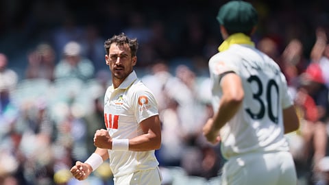Australia's Mitchell Starc celebrates the wicket of England's Jofra Archer during play on the final day of the third Ashes cricket test between England and Australia in Adelaide, Australia
