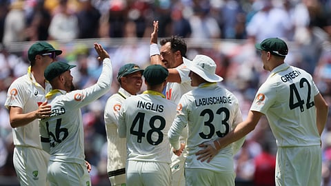 Australia's Mitchell Starc, centre, celebrates the wicket of England's Jofra Archer with his teammates during play on the final day of the third Ashes cricket