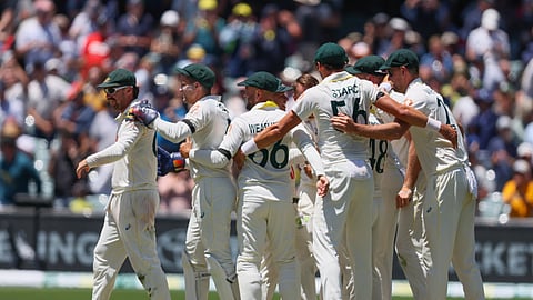 Australia's players celebrate after winning the third Ashes Test against England in Adelaide, Australia, Sunday,