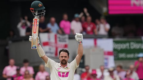 Australia's Travis Head celebrates after scoring a century during play on day three of the fifth and final Ashes cricket test between England and Australia.