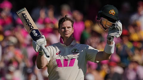 Australia's Steve Smith celebrates after scoring a century during play on day three of the fifth and final Ashes cricket test between England and Australia