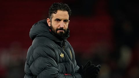 FILE - Manchester United's head coach Ruben Amorim walks on the pitch after the English Premier League soccer match between Manchester United and Wolverhampton Wanderers in Manchester, England.