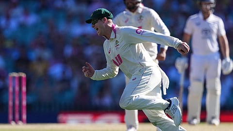Australia's Steve Smith reacts after taking a catch to dismiss England's Ben Stokes during play on day four of the fifth and final Ashes cricket test between England and Australia in Sydney