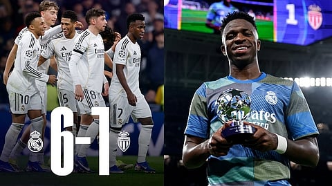 Real Madrid team, with Vinícius receiving the Man of the Match award.