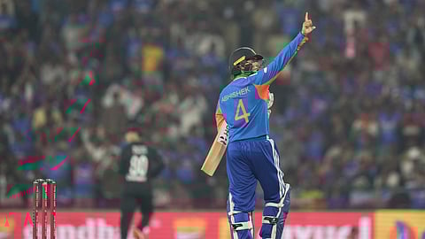 India's Abhishek Sharma celebrates after scoring fifty runs during the first T20 cricket match between India and New Zealand in Nagpur, India.