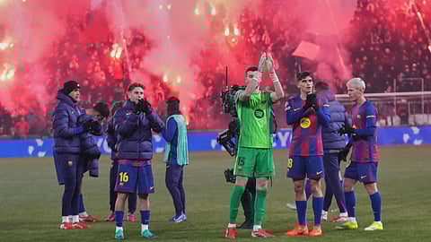 Barcelona players applaud fans at the end of the the Champions League opening phase soccer match between Slavia Prague and Barcelona in Prague, Czech Republic