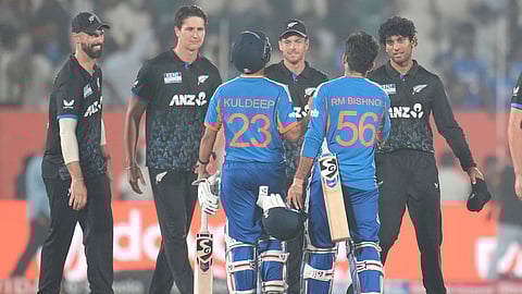 India's Kuldeep Yadav and India's Ravi Bishnoi congratulates New Zealand players after New Zealand won fourth T20 cricket match against India.