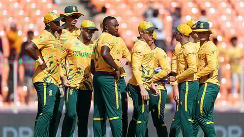 South Africa cricketers celebrate the dismissal of Afghanistan's Fazalhaq Farooqi during the T20 World Cup cricket match between Afghanistan and South Africa in Ahmedabad, India, Wednesday, Feb. 11, 2026. (AP Photo/Ajit Solanki)