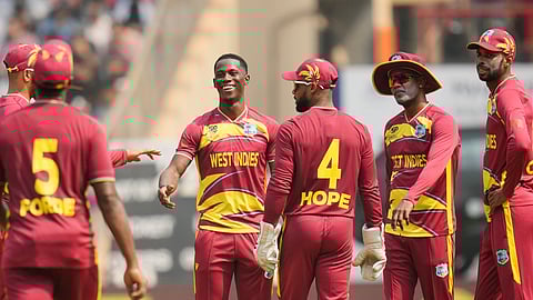 West Indies' Shamar Joseph, second left, celebrates the wicket of Nepal's Lokesh Bam during the T20 World Cup cricket match between Nepal and West Indies in Mumbai, India, Sunday, Feb. 15, 2026. (AP Photo/Rafiq Maqbool)