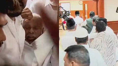 மயங்கிய காதர் மொகிதீனை தூக்கிச் செல்லும் ஐ.எம்.யு.எல். நிர்வாகிகள்