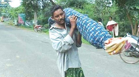 man carry his wifes deadbody