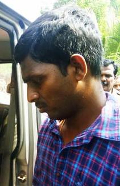 கைது செய்யப்பட்ட ஆசிரியா் பிரேம்குமாா்.