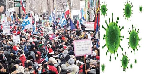 கரோனா தொற்றுப் பரவலைத் தடுப்பதற்காக அறிவித்த கட்டுப்பாடுகளுக்கு எதிர்ப்பு தெரிவித்து கனடாவின் மான்ட்ரியால் நகரில் நடைபெற்ற ஆர்ப்பாட்டம்.