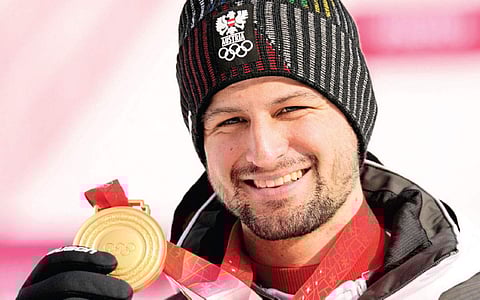 பெய்ஜிங் குளிா்கால ஒலிம்பிக்: தந்தை போல் தங்கம் வென்ற தனையன்