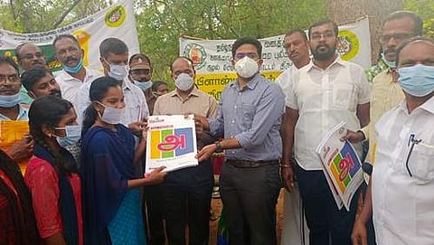 சின்னமயிலாறு காணிக்குடியிருப்பு மாணவிக்கு கல்வி உபகரணங்கள் வழங்குகிறார் ஆட்சியர் விஷ்ணு.