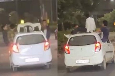 மது போதையில் ஓடும் காரின் மீது உடற்பயிற்சி செய்த இளைஞர்!