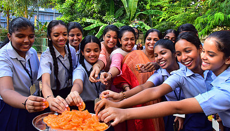 8-5-2024 KOCHI:Students of St. Antony's Higher Secondary School celebrated their exam results by indulging in sweets.Express Photo by A Sanesh (stand