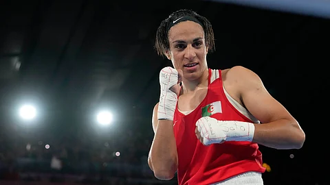 Algeria's Imane Khelif poses after defeating China's Yang Liu to win gold in their women's 66 kg final boxing match at the 2024 Summer Olympics