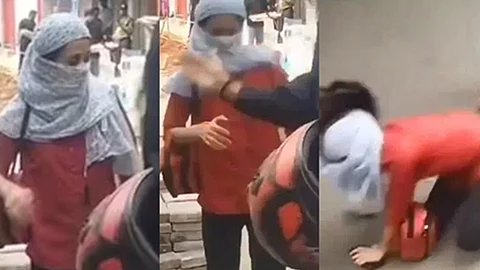 சாலையில் பெண்ணை அறையும் பைக் டாக்ஸி ஓட்டுநர்     
