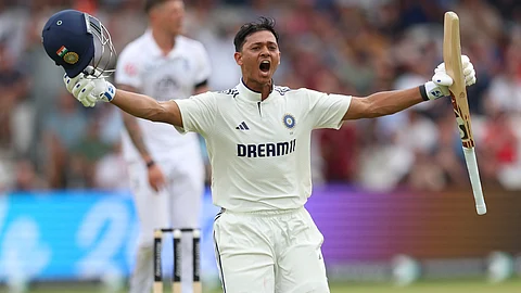 India's Yashasvi Jaiswal celebrates after scoring a century during the play on day one of the first cricket test match