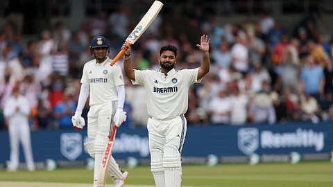 Rishabh Pant celebrates after scoring a century